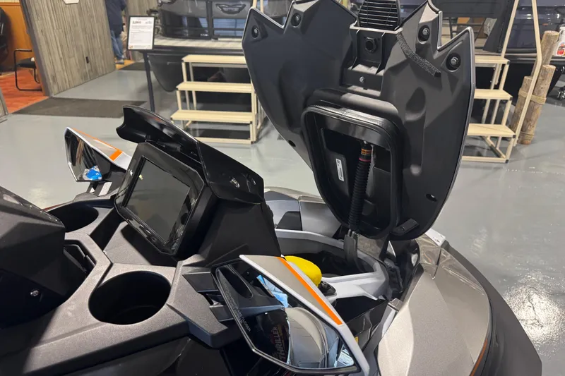 Slide: The Image of 2026 Kawasaki STX160LX dashboard and storage compartment in showroom. - 9