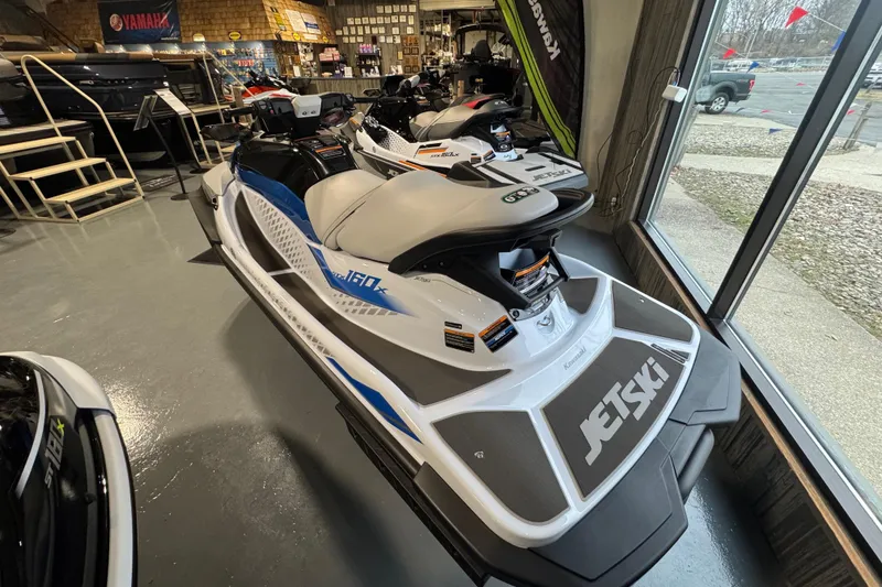 Slide: The Image of 2026 Kawasaki STX160X jet ski displayed in a showroom, featuring sleek design and modern features. - 4
