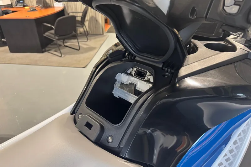 Slide: The Image of 2026 Kawasaki STX160X storage compartment open, showcasing interior design and functionality. - 9