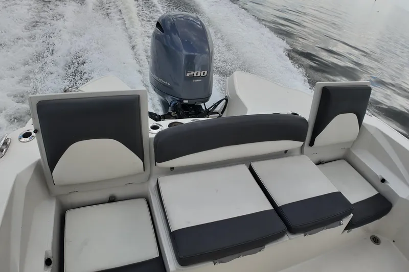 Slide: The Image of 2019 Stingray 236 CC boat with Yamaha 200 engine, featuring comfortable seating and sleek design. - 19