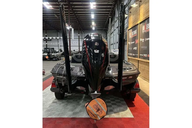 Slide: The Image of 2022 Ranger Z521L boat in showroom, rear view with motor and accessories. - 3