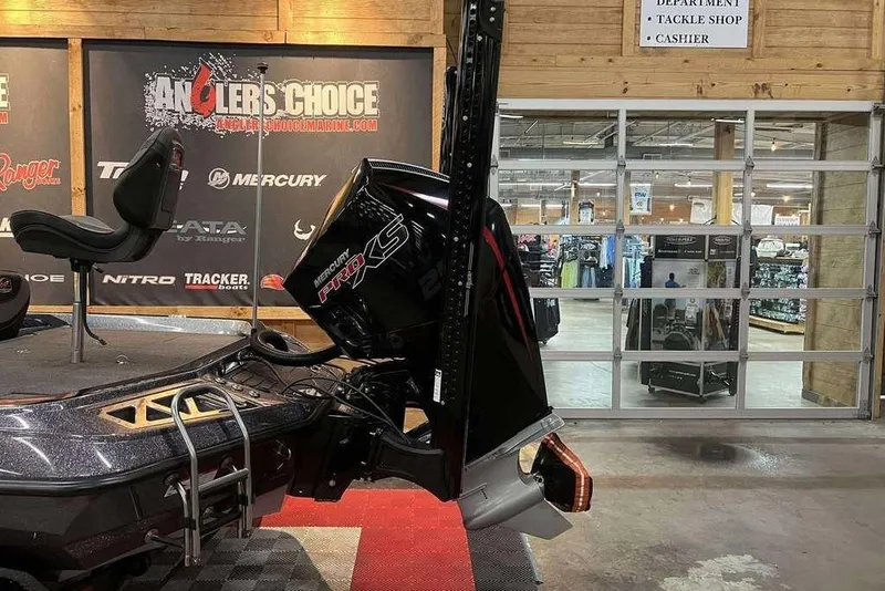 Slide: The Image of 2022 Ranger Z521L boat with Mercury Pro XS engine displayed indoors. - 5