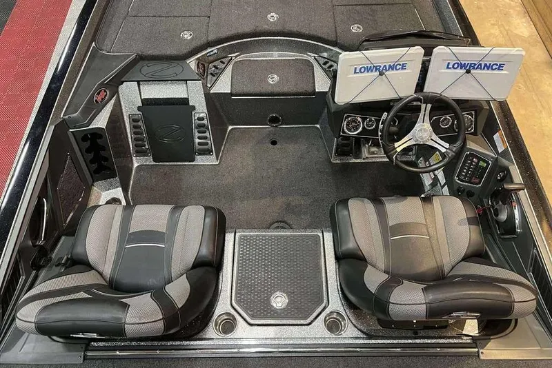 Slide: The Image of 2022 Ranger Z521L boat interior with dual Lowrance displays and comfortable seating. - 8