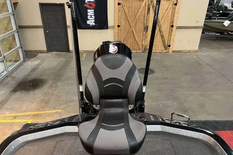 Slide: The Image of 2022 Ranger Z521L boat seat with Power-Pole anchors in a garage setting. - 9