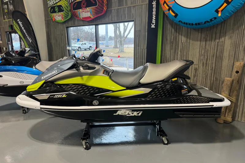 Slide: The Image of 2026 Kawasaki ST160X jet ski in showroom, featuring sleek design and vibrant colors. - 3