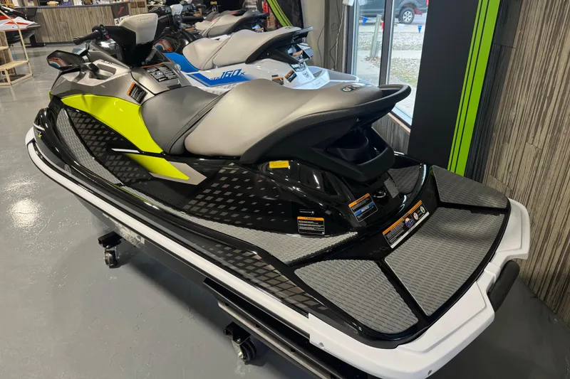 Slide: The Image of 2026 Kawasaki ST160X jet ski in showroom, featuring sleek design and vibrant colors. - 4