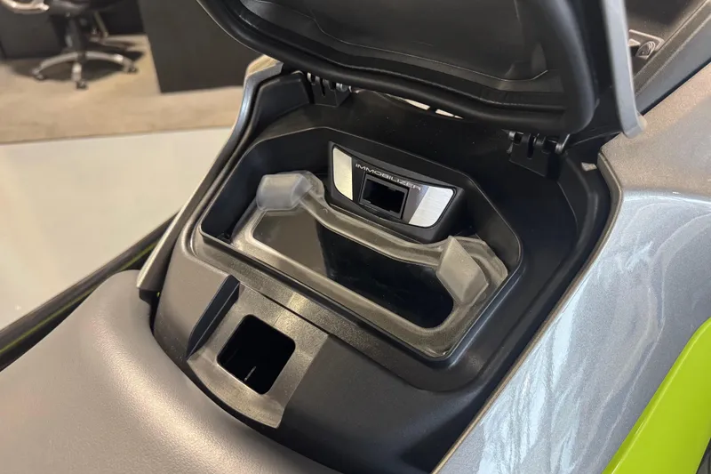 Slide: The Image of 2026 Kawasaki ST160X storage compartment with immobilizer feature, showcasing sleek design. - 8