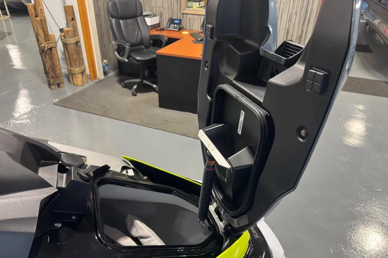 Slide: The Image of 2026 Kawasaki ST160X storage compartment open in an office setting. - 9