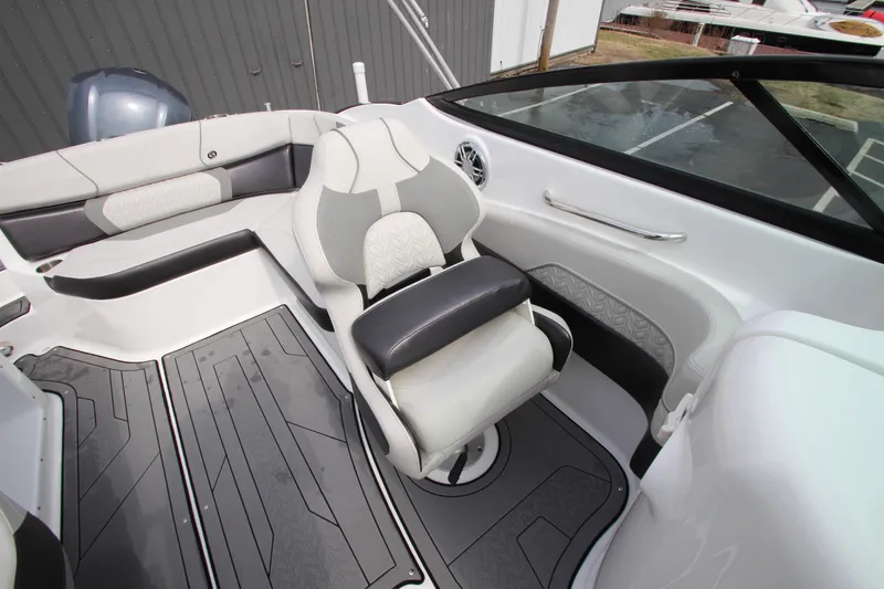 Slide: The Image of 2021 Hurricane SunDeck 2400 OB boat interior with sleek seating and modern design. - 18