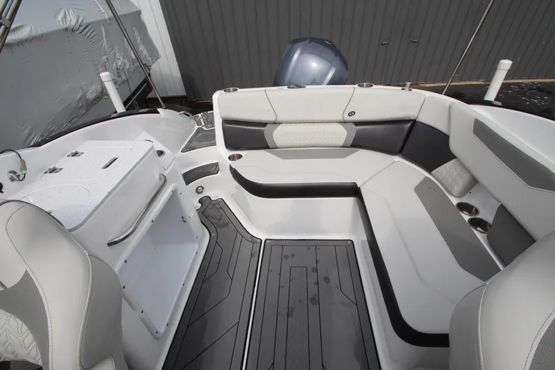 Slide: The Image of 2021 Hurricane SunDeck 2400 OB boat interior with sleek seating and modern design. - 20