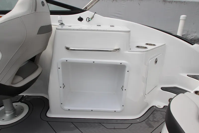 Slide: The Image of 2021 Hurricane SunDeck 2400 OB boat interior with seating and storage area. - 23