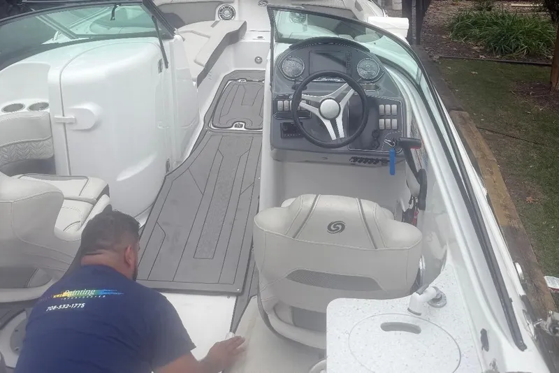 Slide: The Image of 2021 Hurricane SunDeck 2400 OB interior with steering console and seating. - 5