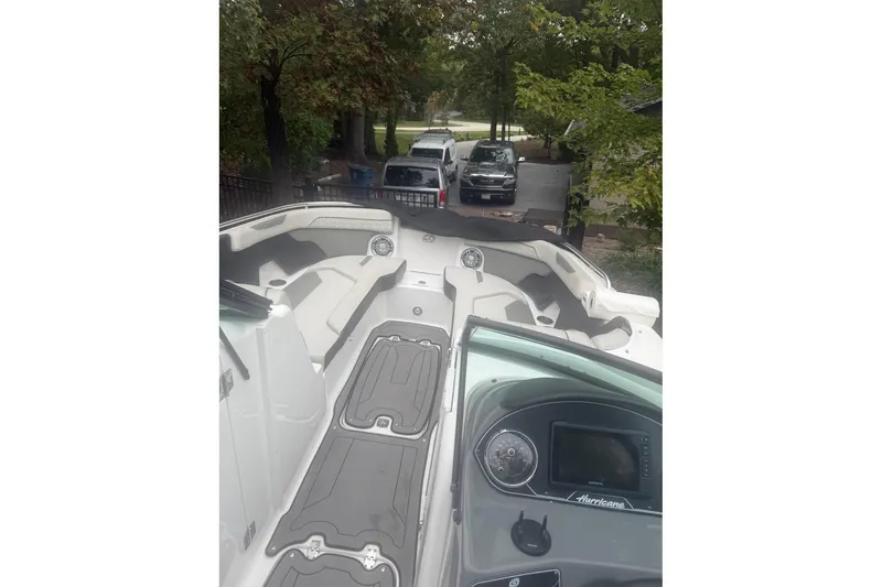 Slide: The Image of 2021 Hurricane SunDeck 2400 OB boat interior with seating and dashboard view. - 8