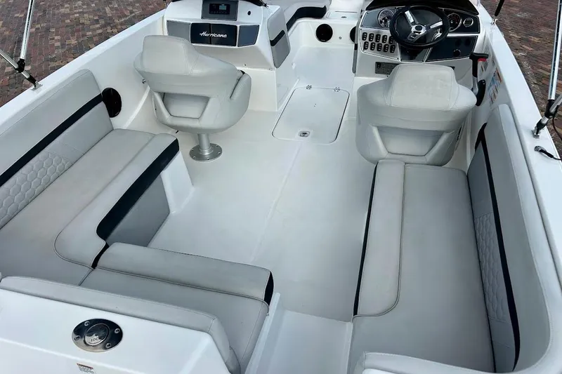 Slide: The Image of 2024 Hurricane Kayaks SS 218 interior with white seating and modern dashboard. - 13