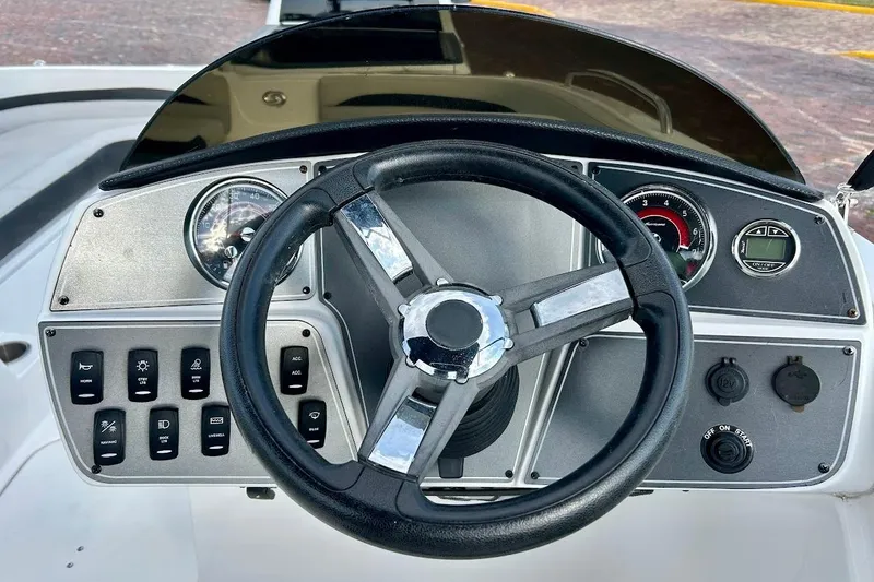 Slide: The Image of 2024 Hurricane Kayaks SS 218 dashboard with steering wheel and control panel. - 14