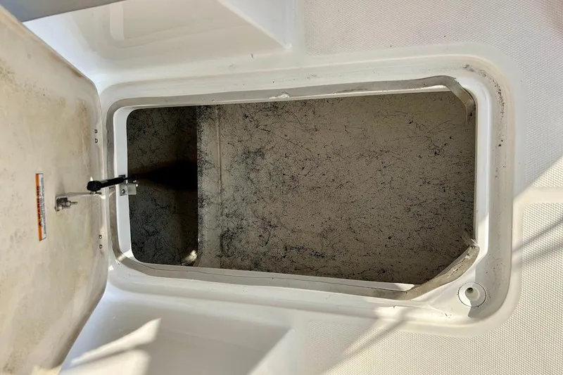 Slide: The Image of Open storage compartment of 2024 Hurricane Kayaks SS 218, showing interior details. - 27