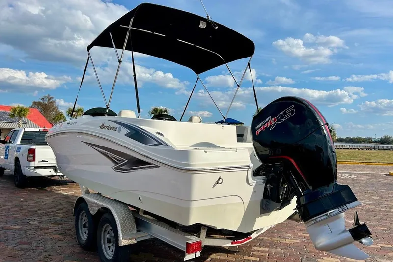 Slide: The Image of 2024 Hurricane Kayaks SS 218 boat with Mercury Pro XS engine on trailer. - 4