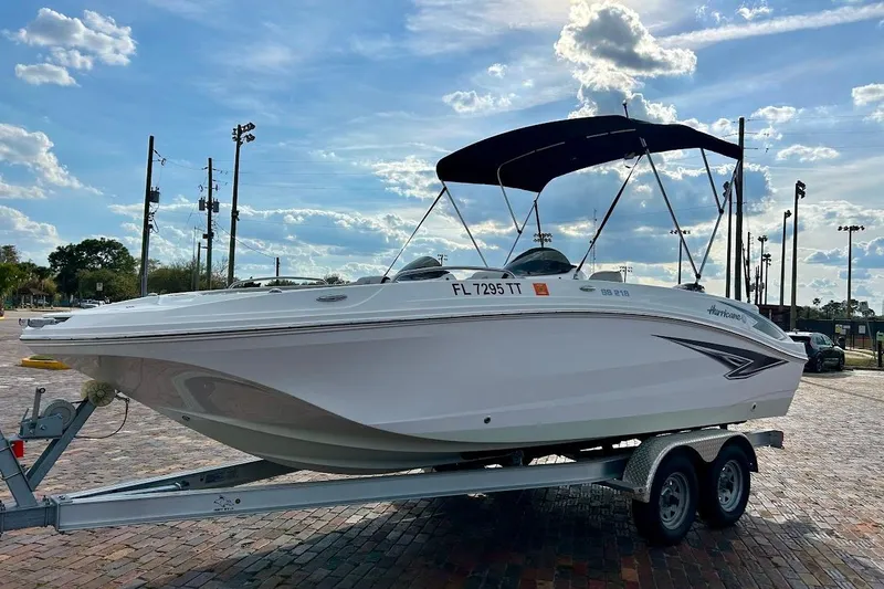 Slide: The Image of 2024 Hurricane Kayaks SS 218 boat on trailer under blue sky. - 5