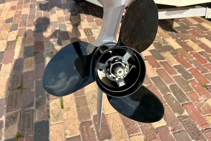 Slide: The Image of Close-up of a 2024 Hurricane Kayaks SS 218 propeller on a brick surface. - 9