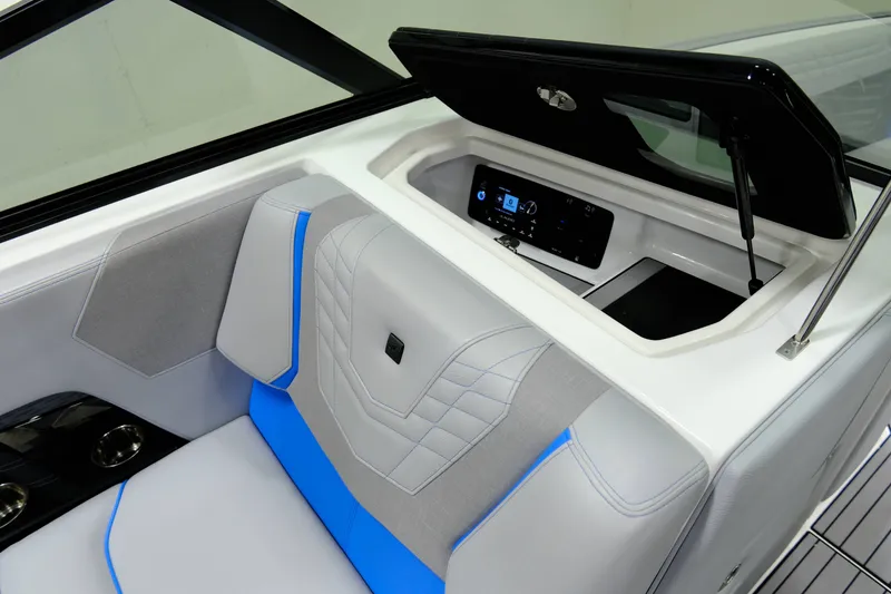 Slide: The Image of 2023 Nautique G23 interior with seating and storage compartment. - 14