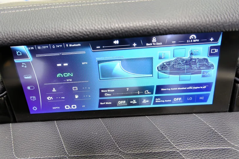 Slide: The Image of 2023 Nautique G23 boat display with control features and settings. - 16