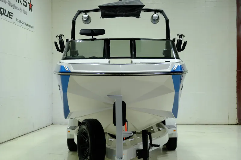 Slide: The Image of 2023 Nautique G23 boat in a showroom. - 4