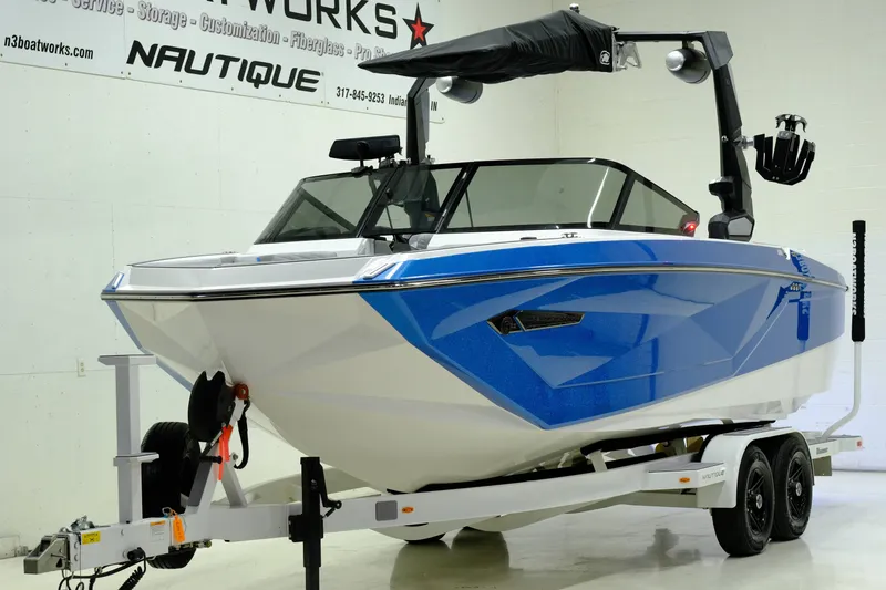 Slide: The Image of 2023 Nautique G23 boat in a showroom. - 6