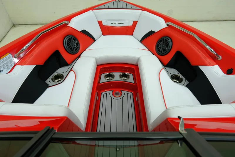 Slide: The Image of Interior of a 2018 Nautique 210 boat with red and white seating. - 14