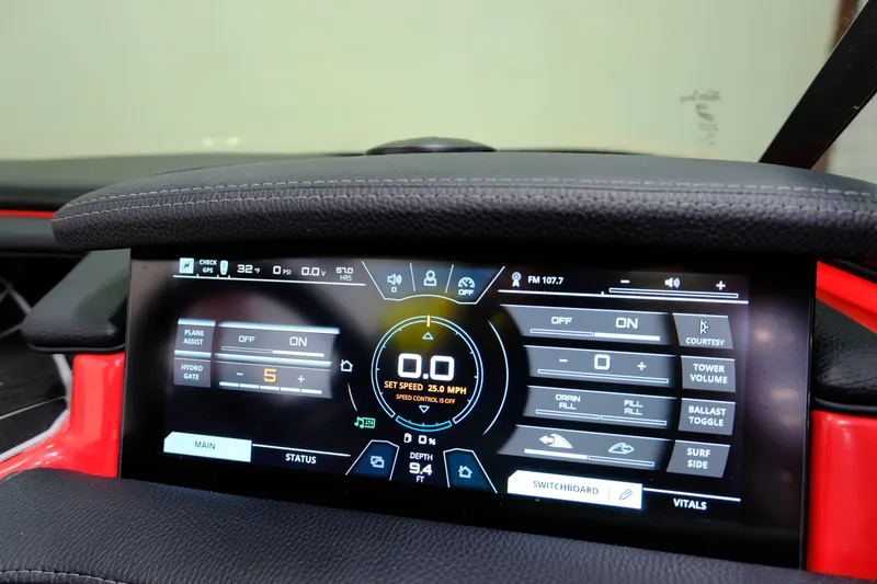 Slide: The Image of Touchscreen display of a 2018 Nautique 210 boat with control options. - 18