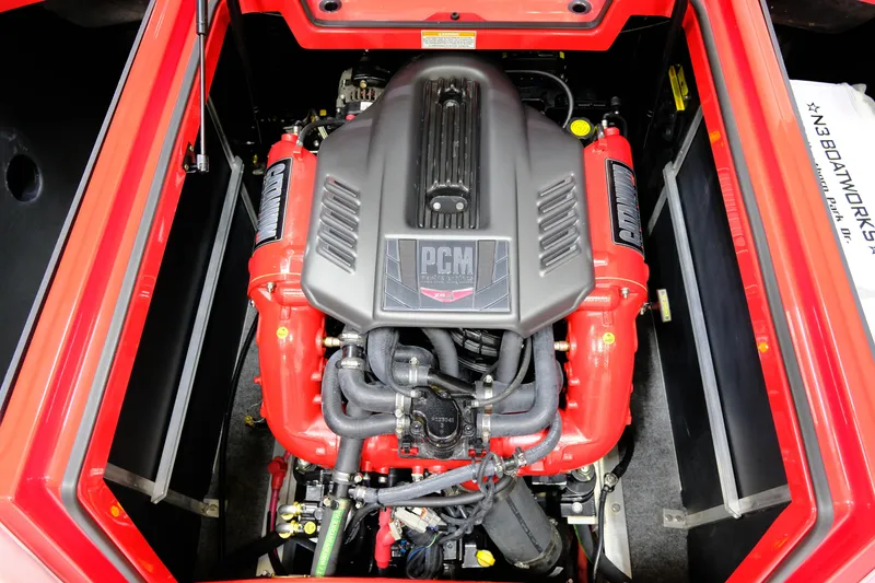 Slide: The Image of Engine of a 2018 Nautique 210 boat, red and black. - 20