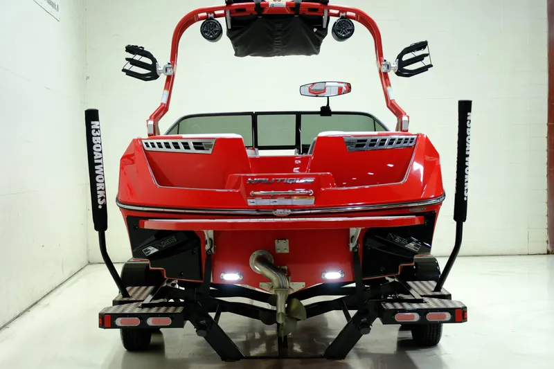 Slide: The Image of Red 2018 Nautique 210 boat on trailer, rear view. - 8