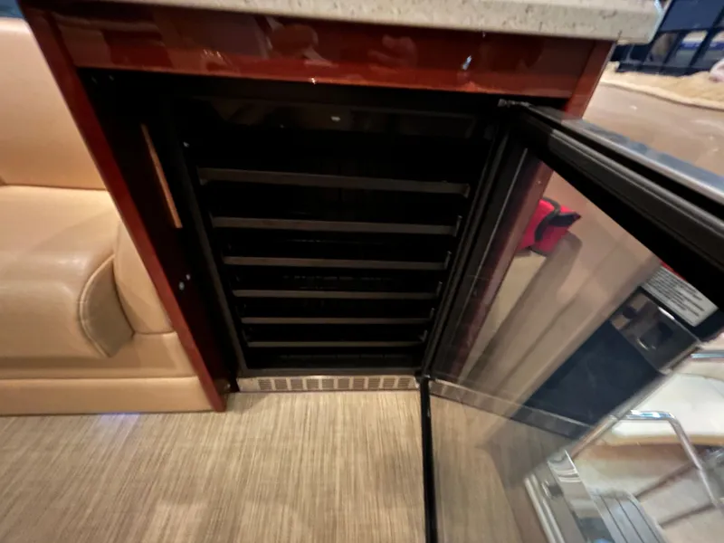 Slide: The Image of Open fridge in Sea Ray 610 Sundancer 2010 yacht. - 16