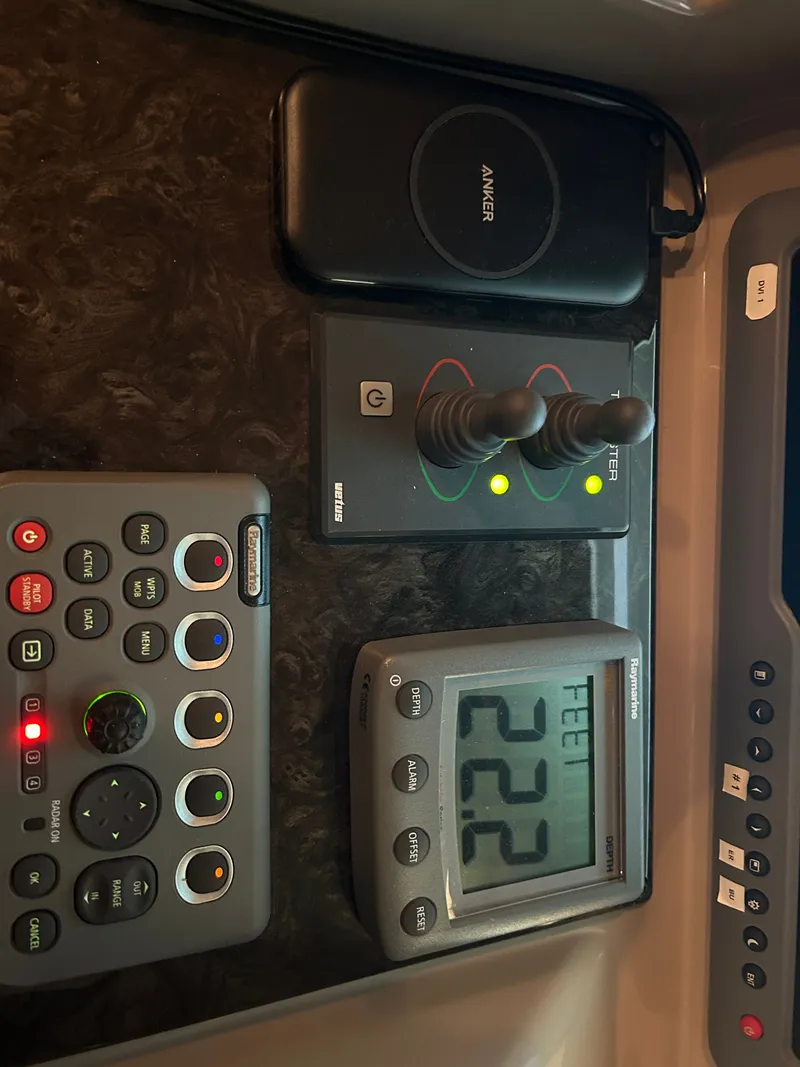 Slide: The Image of Control console of 2010 Sea Ray 610 Sundancer with joysticks and display. - 22