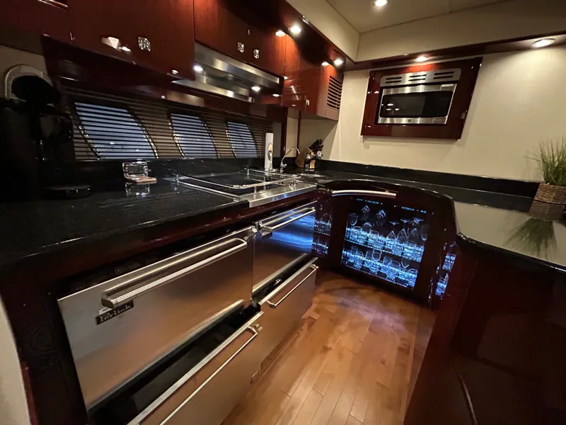 Slide: The Image of Luxurious kitchen on a 2010 Sea Ray 610 Sundancer yacht. - 30