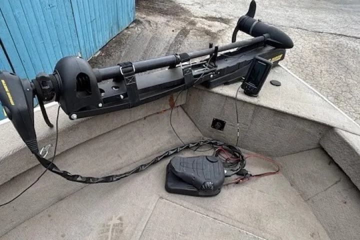 Slide: The Image of Trolling motor setup on a 2003 Monark King 190 boat, featuring a foot pedal and fish finder. - 11