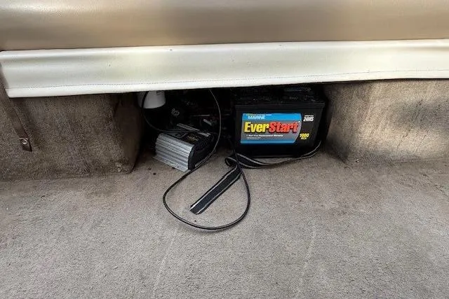 Slide: The Image of Battery and charger setup in a 2003 Monark King 190 boat. - 29