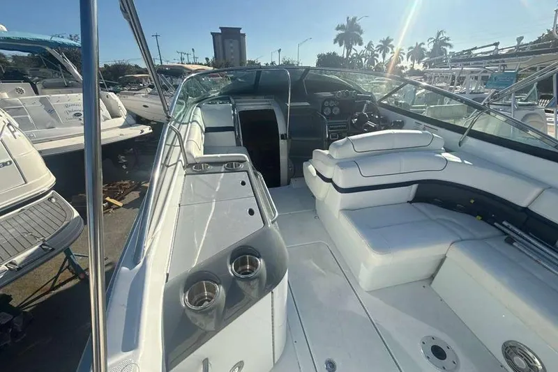 Slide: The Image of 2014 Formula 290 Sun Sport boat interior with white seating and cup holders. - 19