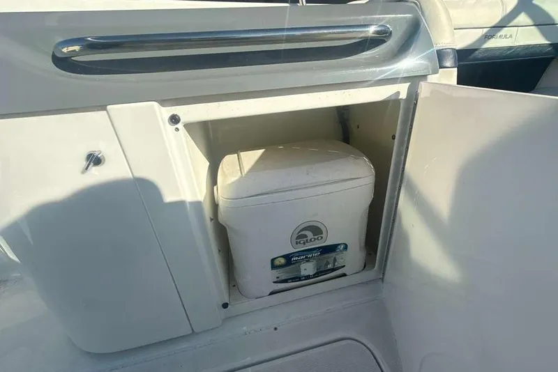 Slide: The Image of 2014 Formula 290 Sun Sport boat with Igloo marine cooler in storage compartment. - 22