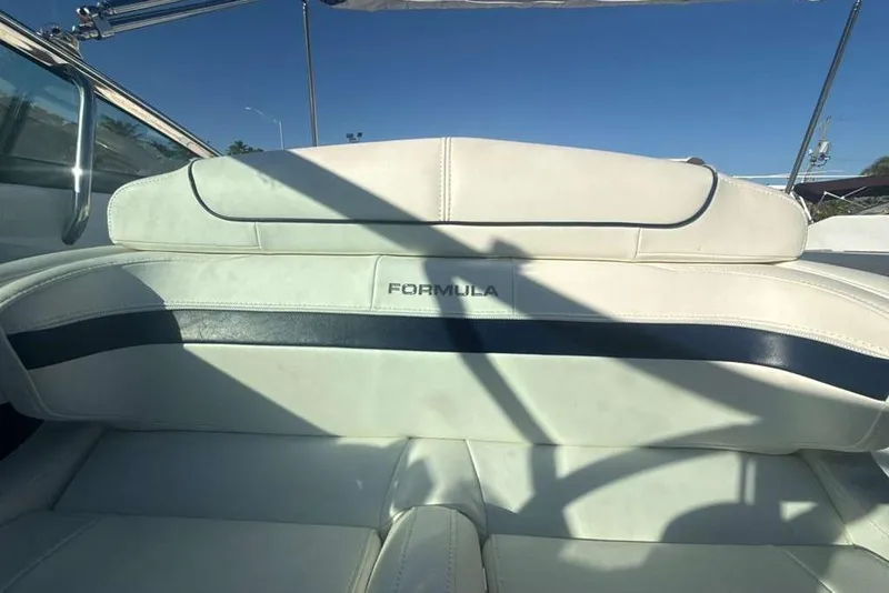 Slide: The Image of 2014 Formula 290 Sun Sport boat interior with white and navy seating. - 24