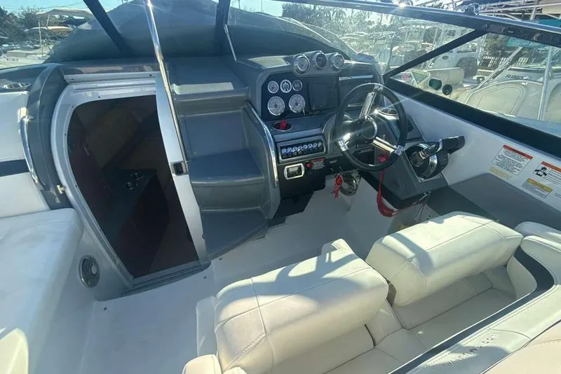 Slide: The Image of Interior view of 2014 Formula 290 Sun Sport boat cockpit with steering wheel and controls. - 25