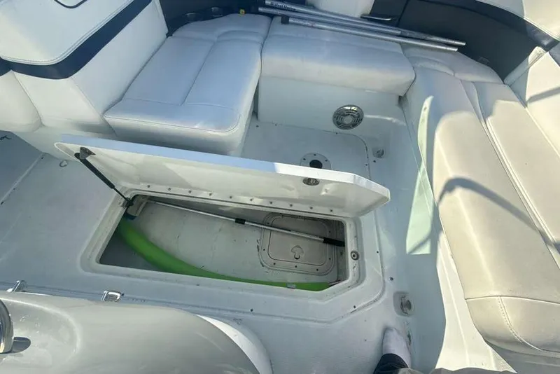Slide: The Image of 2014 Formula 290 Sun Sport boat interior with open storage compartment. - 26