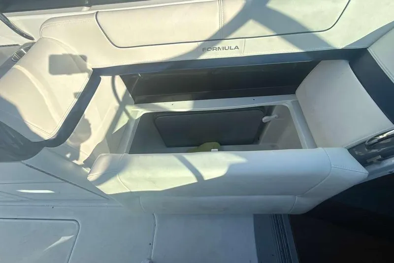 Slide: The Image of 2014 Formula 290 Sun Sport boat interior with open storage compartment. - 34