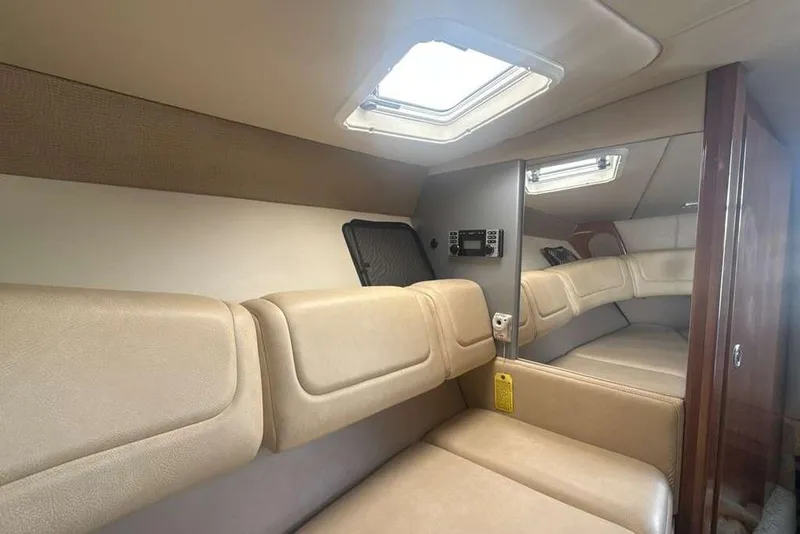 Slide: The Image of Interior cabin of 2014 Formula 290 Sun Sport with beige seating and skylight. - 37