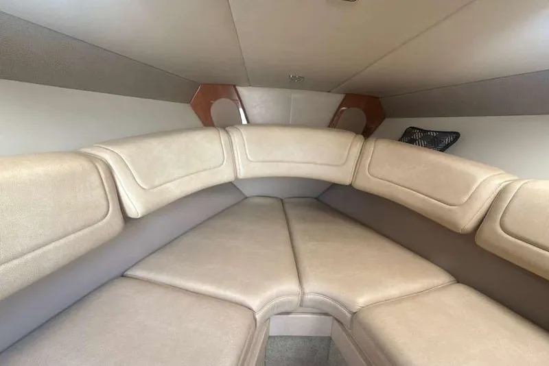 Slide: The Image of Interior cabin of 2014 Formula 290 Sun Sport boat with beige seating. - 38
