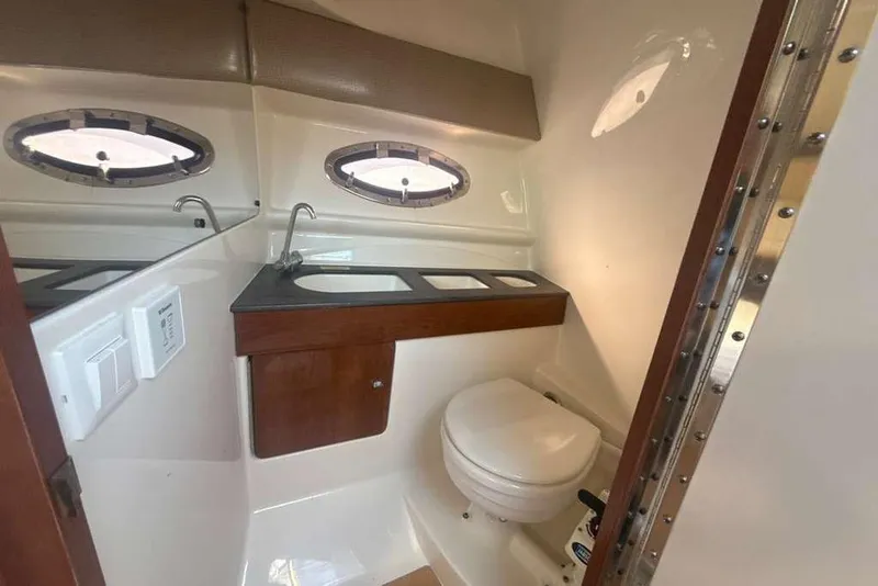 Slide: The Image of 2014 Formula 290 Sun Sport boat bathroom with sink and toilet. - 40