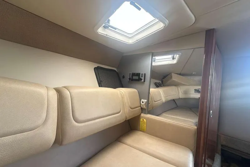 Slide: The Image of Interior of 2014 Formula 290 Sun Sport boat with beige seating and skylight. - 42