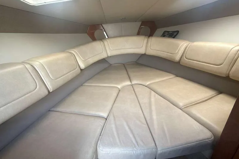 Slide: The Image of 2014 Formula 290 Sun Sport cabin interior with beige seating and modern design. - 43