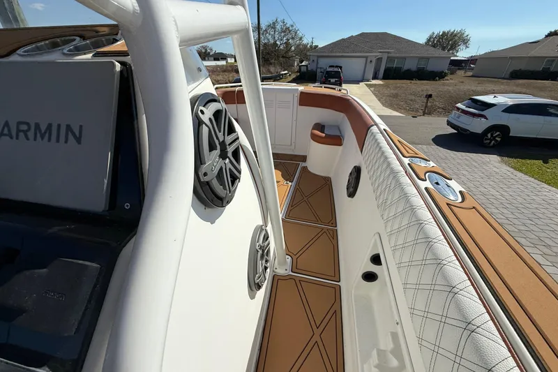 Slide: The Image of 2005 Renegade 29CC boat interior with Garmin system and stylish seating. - 17