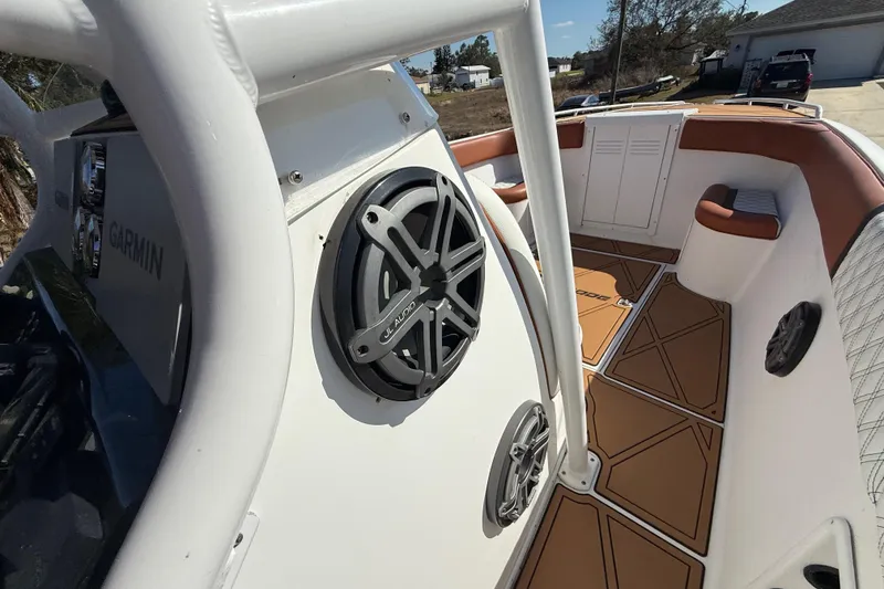 Slide: The Image of 2005 Renegade 29CC boat interior with Garmin system and JL Audio speakers. - 18