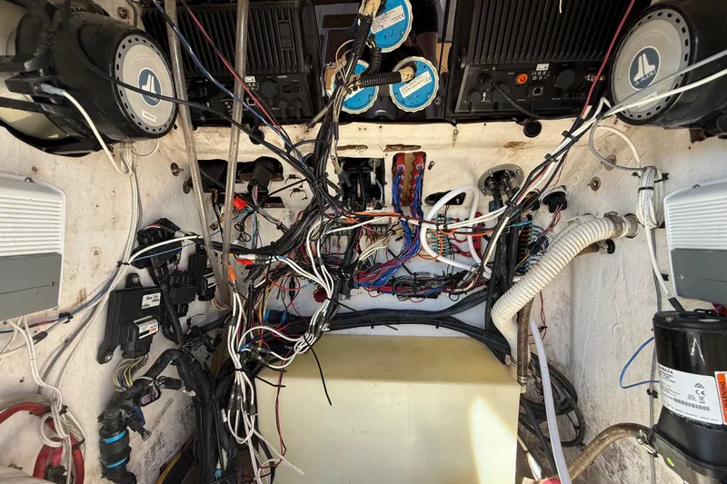 Slide: The Image of Interior wiring of a 2005 Renegade 29CC boat, showcasing complex electrical systems. - 23